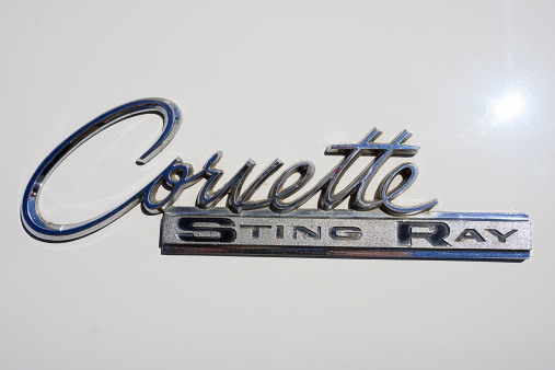 Rocklin, USA - August 18, 2012: Corvette Sting Ray Emblem on an older model white Corvette automobile. Corvettes are high performance luxury autos manufactured by General Motors Chevrolet division.