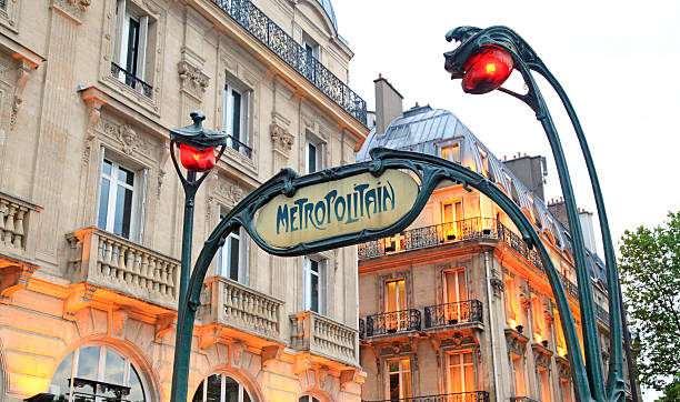 Metropolitain sign in Paris, France Paris, France - June 2, 2012: Metropolitain sign at Saint Michel station in Paris, France. The Paris MAtro comprises 301 stations and 385 train halls. From the original plain white tilework and art nouveau entrances, station decoration has evolved with successive waves of building and renovation. paris metro sign stock pictures, royalty-free photos & images