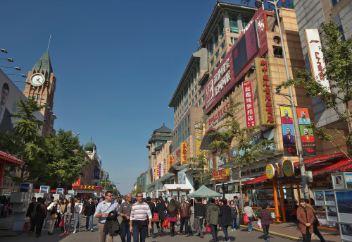 Beijing,China - Oct 19,2013: Wangfujing Street.Wangfujing is the most well-known and prosperous business street with modern and fashion trends,it is the busiest street in Beijing.There are thousands of  people  from all over the world every day.