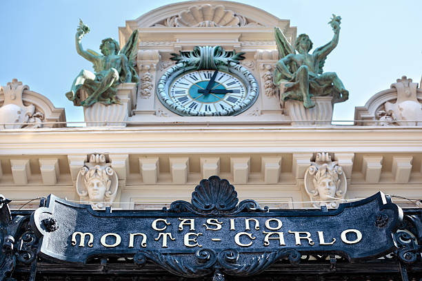 Monte Carlo, Monaco - September 21, 2013:  Front entrance canopy, signage and clock tower of the famous casino at Monte Carlo, Monaco.