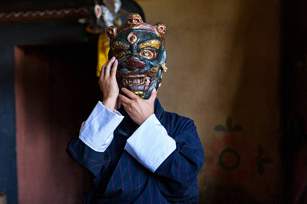 Buthanese man with traditional mask for fire festival in Thangbi stock photo