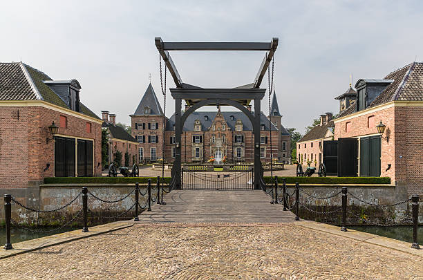 Delden, The Netherlands -  August 29, 2013: Beautiful castle 'Twickel' with castle-moat and drawbridge near Delden in the Netherlands