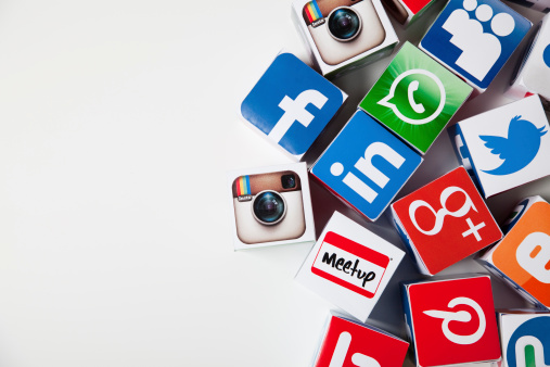 London, United KIngdom- September 24, 2013: Social media logos printed onto handmade cubes. photographed in a studio. Social media uses web and mobile technology to connect people