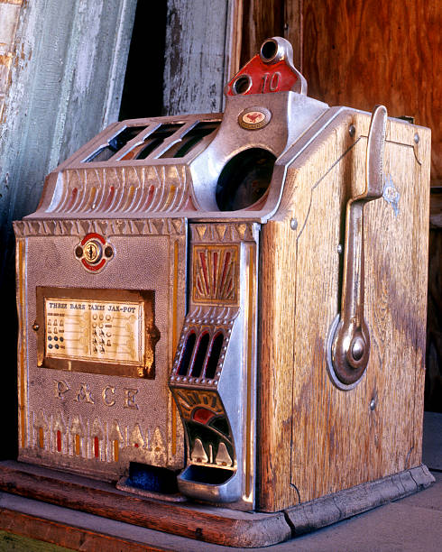 Bodie, California, USA - September 22, 2003:  Pace Slot Machine with worn and dusty condition visible. Located in the Sam Leon Bar at Bodie State Historic Park at the time of photo. The town is kept in a state of 