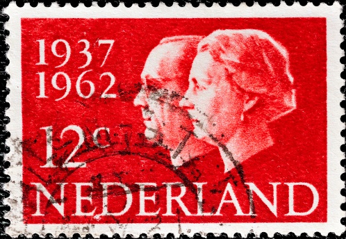 Stockholm, Sweden - February 11, 2013: An red stamp printed in the Netherlands. Stamp shows the Nederland king Bernhard and queen Juliana, circa 1962.