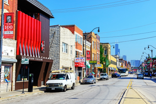 Chicago, USA - July 5, 2013: Wentworth Avenue in the center of Chinatown, Chicago.  Busy commercial street with background people. Located in the Amour Square community area of Chicago, on the South Side.