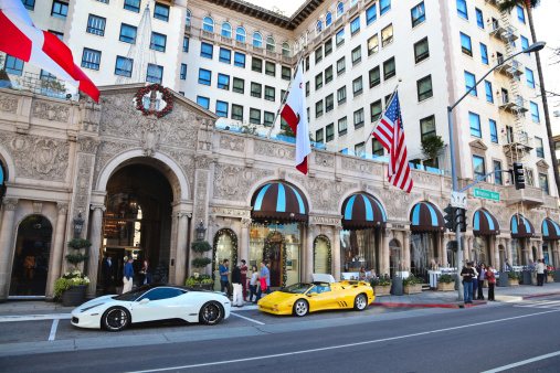 Beverly Hills, USA - November 23, 2012: Tourists of Los Angeles passing by the Beverly Wilshire Hotel on Wilshire Boulevard in Beverly Hills, California