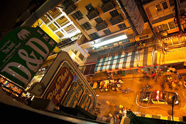 Bangkok, Thailand - October 19, 2012: The police make an attempt to send people home as crowds of people continue to party late into the night at the famous backpackers haven of Khao San Road in Bangkok, Thailand.