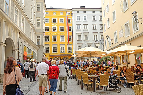 Salzburg, Austria - July 30, 2013: Tourists go to the Mozart's Birthplace. Mozart lived on the third floor of the \