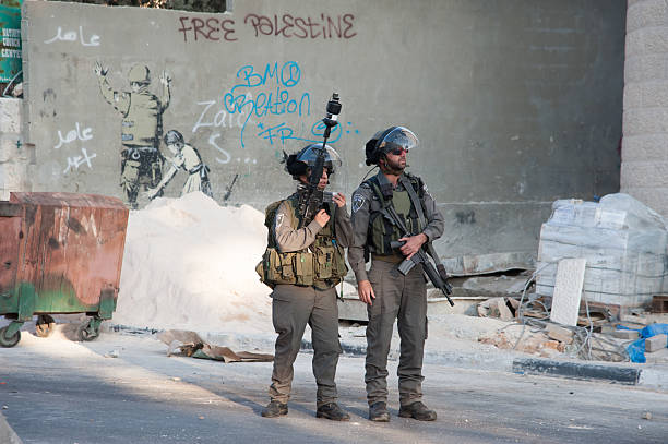 West Bank Israeli military occupation and Banksy mural stock photo
