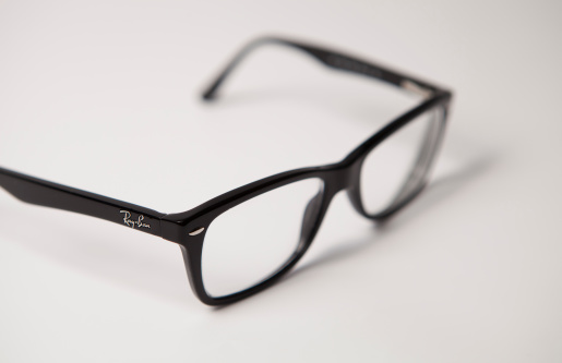 Lake Hopatcong, NJ, USA - July 15, 2013: Classic Ray-Ban Eyeglasses on a white background.