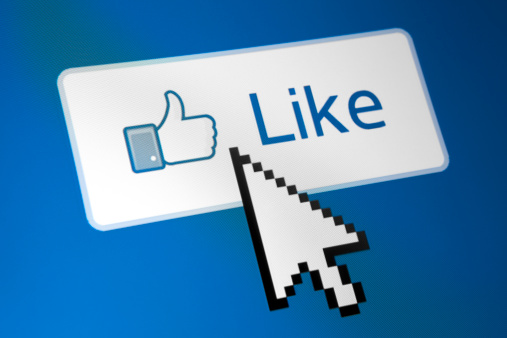 Nizhnevartovsk, Russia - September 7, 2012: Close up shot Facebook like button on monitor screen with Windows system cursor icon. Famous feature of the social network Facebook.