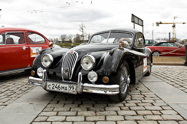 Moscow, Russia aa April 21, 2013: retro car jaguar on rally of classical cars on Poklonnaya hill, unidentified people inside car.