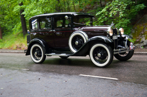 Stockholm, Sweden - June 03,2012 :Car enthusiast driving a  fully restored Ford A from 1930, in a classic car cavalcade around the small island Djurgarden on the public road in Stockholm Sweden