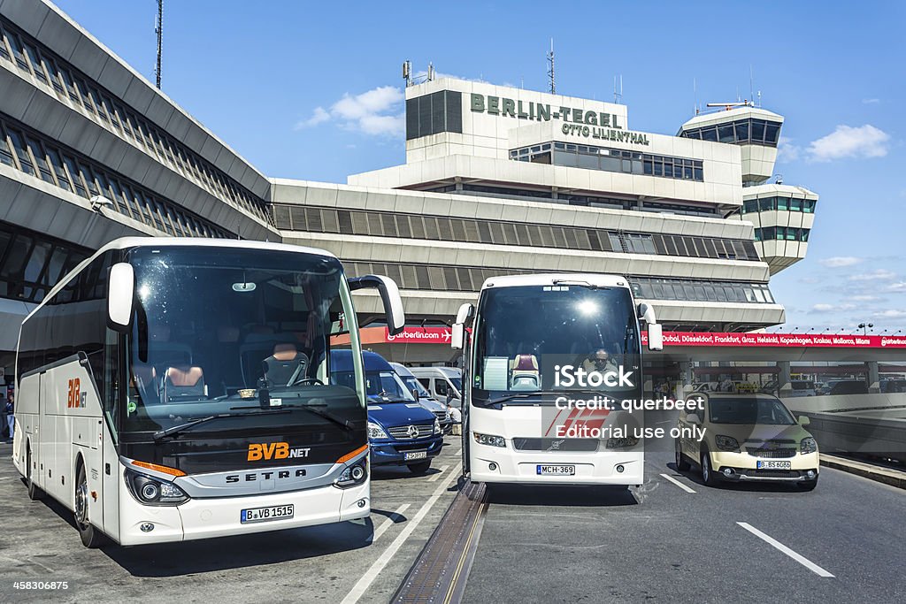 Tegel Airport Otto Lillienthal Berlin, Germany - August 26, 2013: Airport Tegel, Berlin (Otto Lilienthal). 2 parking buses and 1 taxi in front of the AIRPORT . On building is a written banner of airline AIR BERLIN. Air Berlin Stock Photo