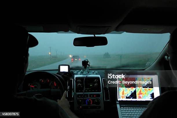 Storm Chasers With Computer Technology In Motor Vehicle Stock Photo - Download Image Now