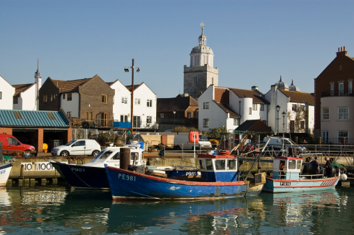Portsmouth, England - March 28, 2012: Fishing vessels unloading a catch at Camber Dock in Old Portsmouth.