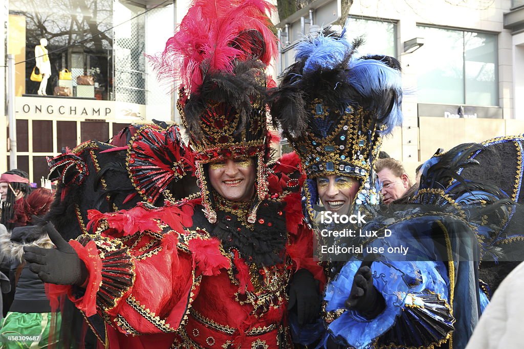 Dusseldorf street carnival DAsseldorf, Germany - February 10, 2013: Two men posing in rio carnival costumes during Sunday KAnigsallee street carnival parade. Adult Stock Photo