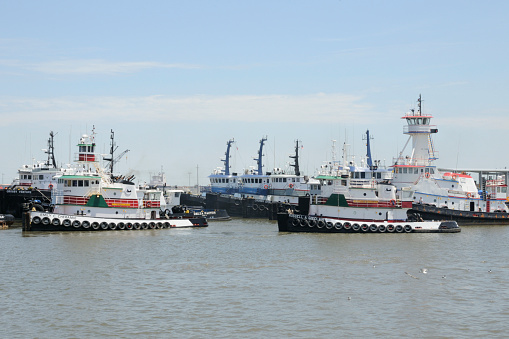 Por Fouchon, Louisiana, USA - April 27, 2010: Tug boats at Port Fourchon near Grand Isle. The sea port supports the Gulf of Mexico oil industry.