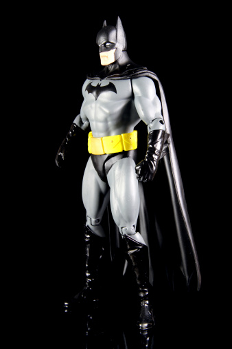Vancouver, Canada - October 4, 2012: Action figure model of Batman, sculpted by Paul Harding and released by DC comics, against a black background.