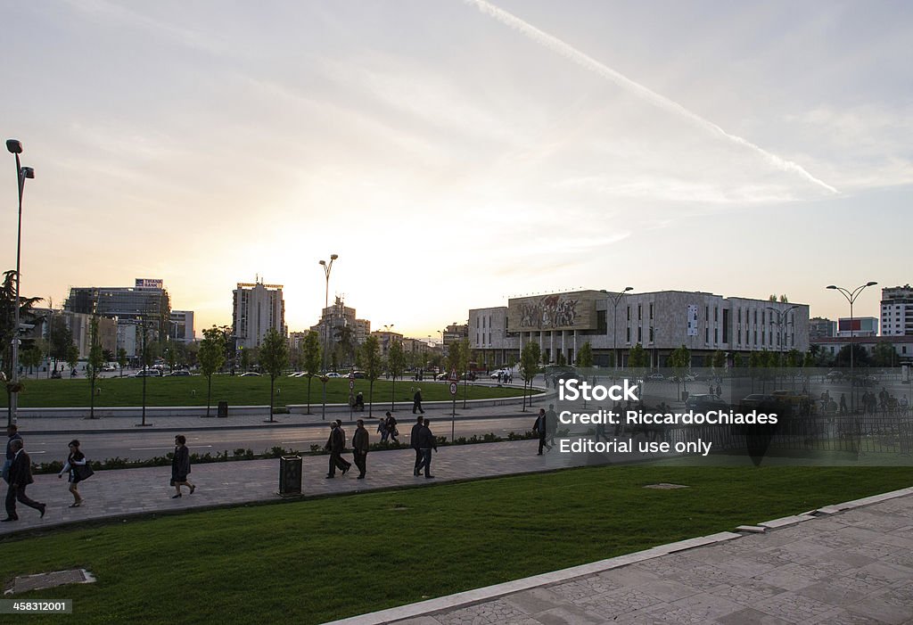Skanderbeg square at dusk Tirana Albania-April 13,2013:Urban life in Tirana at the sunset,people are driving and walking with the national historical museum in background Albania Stock Photo