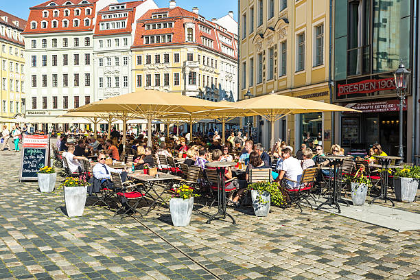Dresden, Germany - September 06, 2013: Restaurant with many people in front of the famous Frauenkirche in Dresden.