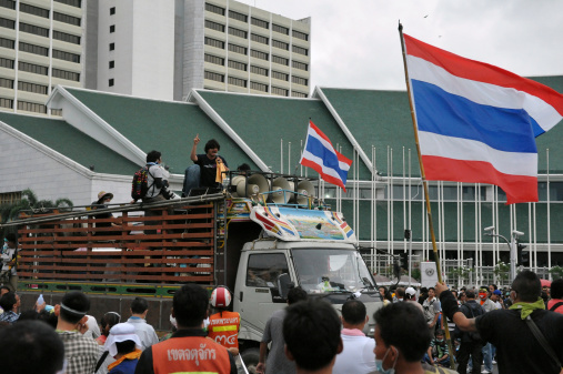 Bangkok, Thailand - November 24, 2012: Protesters from the nationalist Pitak Siam group hold a large anti-government rally outside the UN Asia Pacific headquarters on Makhawan Bridge.
