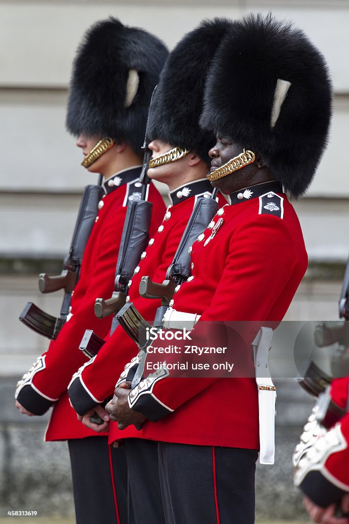 At attention London, UK - July 4, 2012: Queen's Guard soldier not maintaing proper at attention stad during Changing of the Guard ceremony in front of Buckingham Palace British Royal Guard Stock Photo
