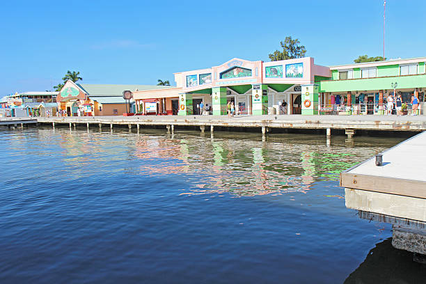 Belize City, Belize - December 26, 2011: Cruise ship passengers head back to the tenders by the shops at the Belize City Cruise Ship Terminal on the day after Christmas, December 26, 2011. The cruise ship terminal has shops, immigration and access to numerous tours throughout the rest of the country.