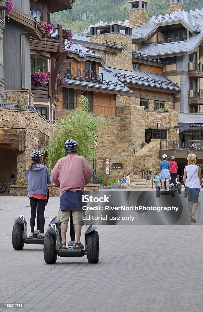 Lionshead Village, Vail, Colorado Vail, Colorado, USA - July 25, 2013: People on Segways and walking in the Lionshead Village, a shopping and dining area in Vail, Colorado. Building Exterior Stock Photo