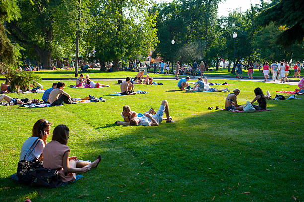Moscow, Russia - July 8, 2012: People resting in the Gorky Park.  In recent years Gorky Park has been fully renovated to create a modern space for recreation of the urbanites.