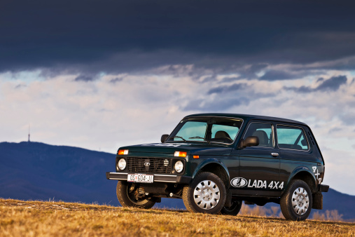 Zagreb, Croatia - February 27, 2012: Russian iconic off-roader Lada Niva on the high crest before mountain Medvednica.