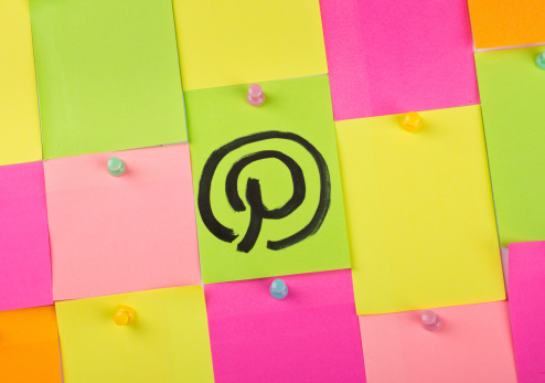 Wuhan, China - August 31, 2012: Pinterest logo on a post-it note and pinned on a bulletin board. Pinterest is a social networking website where users post images that they find interesting.