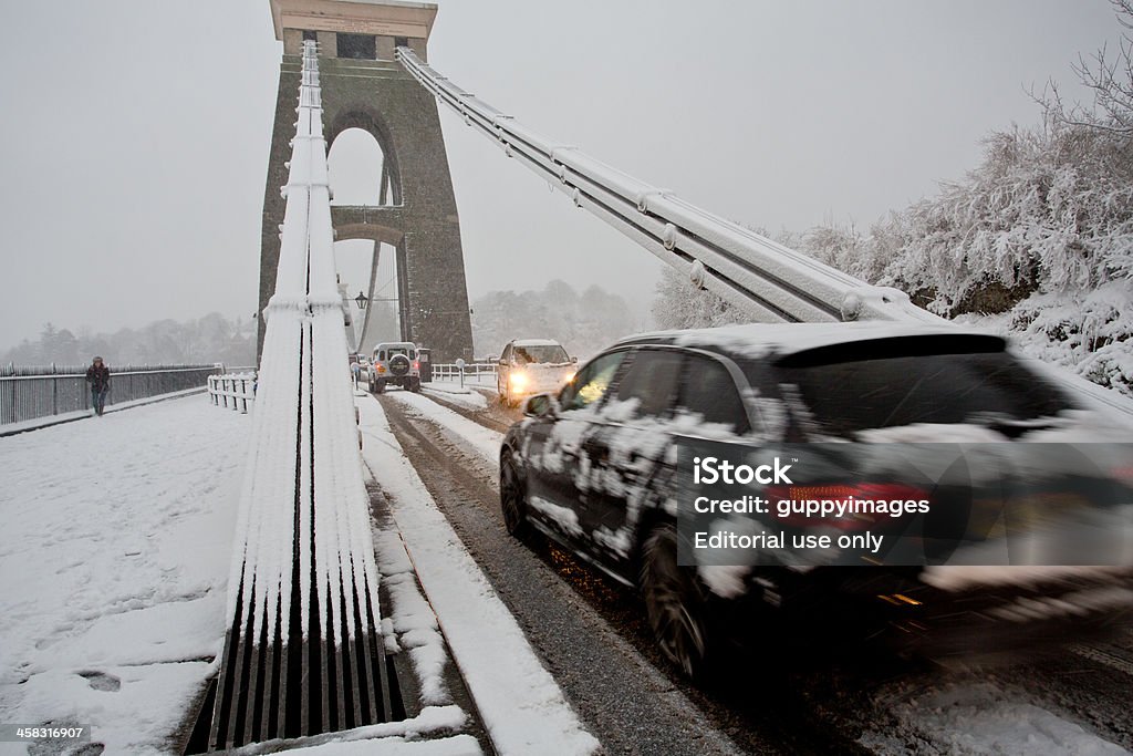 Heavy traffic with estate car crossing Clifton Suspension bridge Clifton, Bristol, UK - January 18, 2013: People struggle to get to work given heavy amounts of snowfall. The worst affected area is South Wales, but there has also been significant snowfall in the South West of England Architecture Stock Photo