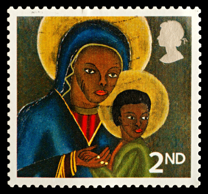 Exeter, United Kingdom - November 21, 2010: British Used Christmas Postage Stamp showing Black Madonna and Child from Haiti, printed and issued in 2005