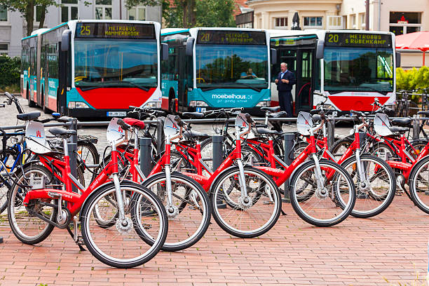 Hamburg, Germany - June 21, 2011: View of a row of Stadrad bicycles that are available for hire near the train station in Hamburg Altona with some busses parked in the background.