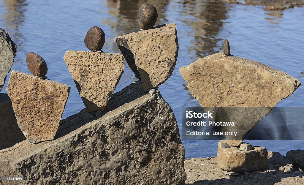 Stones Like People Ottawa, Canada aa August 18, 2012: A pile of balanced stones at the International Stone Balance Festival at Remic Rapids and the Ottawa River in Ottawa, Ontario. 2012 Stock Photo