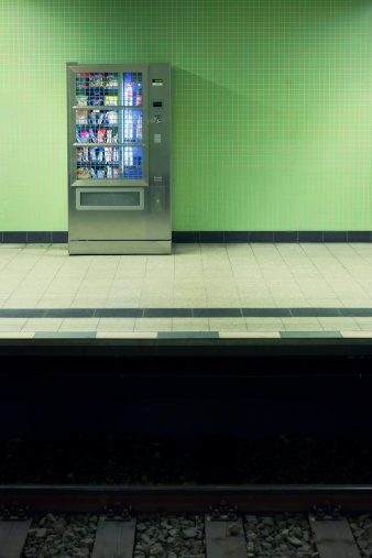 Berlin, Germany - May 16, 2012: A vending machine with drinks and goodies standing on a station platform.