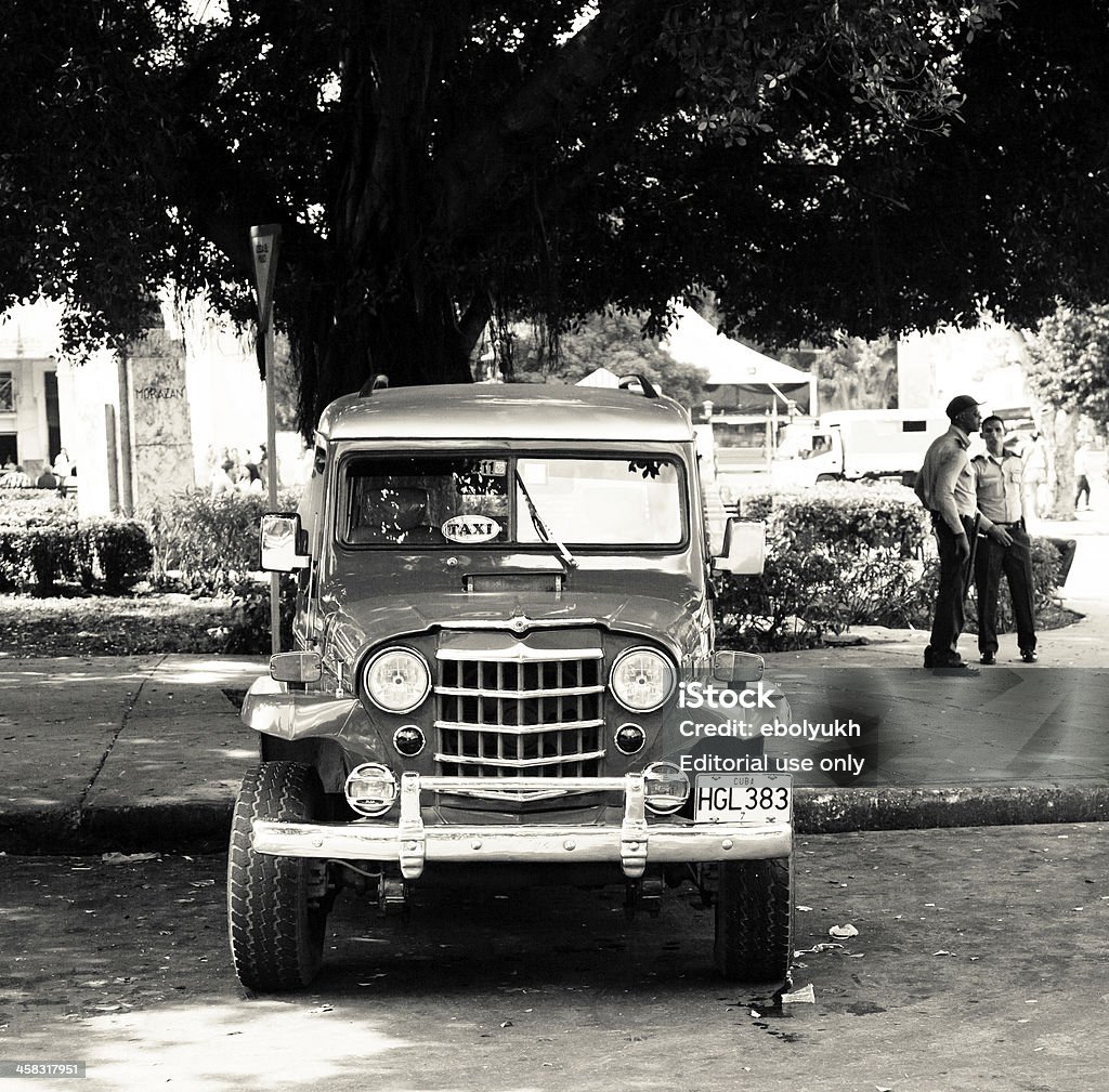 Old classic car in Havana Havana, Cuba - February 23, 2010: Old classic 1950 Willys on Havana street. With an estimated 60,000 vintage cars still in Cuba, these old classics are a tribute to the nostalgia of the old days. Ancient Stock Photo