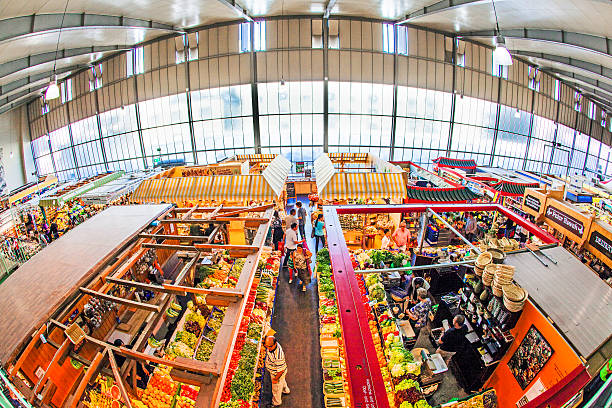 Frankfurt, Germany - October 1, 2011: people enjoy shopping in the Kleinmarkthalle  in Frankfurt, Germany. The Kleinmarkthalle from 1954 is the most famous fresh food market place in Frankfurt on 1500 SQ (m2).