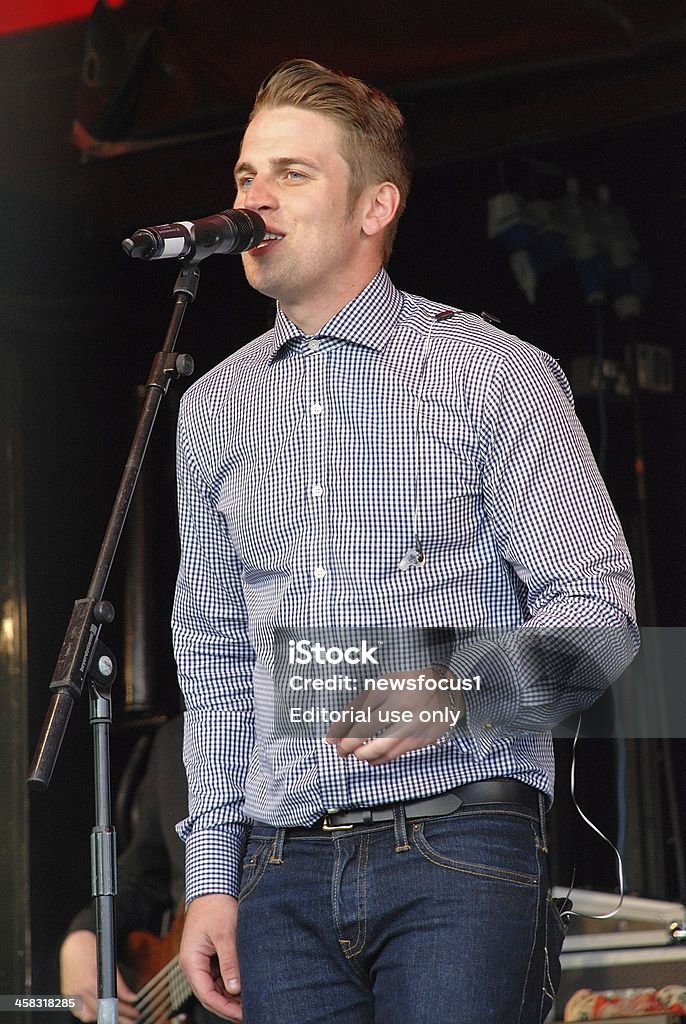 Adam Chandler Tenterden, England - July 1, 2012: Adam Chandler, British rock and pop singer, performs live on stage at the Tentertainment music festival. In 2007 his band Futureproof were finalists on television reality show The X Factor. Lead Singer Stock Photo