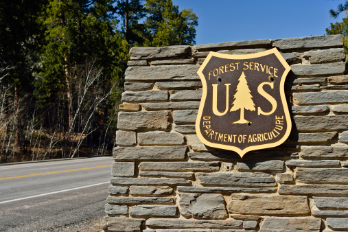 Keystone, South Dakota, USA - April 2, 2013: The emblem of the US Forest Service, part of the Department of Agriculture outside of Keystone, South Dakota.