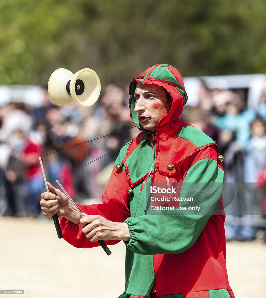 Medieval Entertainer Montmedy, France, April 29th, 2012: A medieval buffoon performing in front of the audience during a reenactment festival in Montmedy, France. Activity Stock Photo