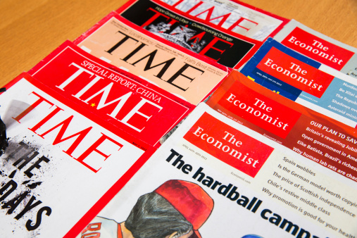 Shanghai, China - Oct 2, 2013: Popular Magazines in English language displayed, including Time and The Economist. Magazines are a great way to learn news, culture and short stories. They generate the majority of their income through advertising.