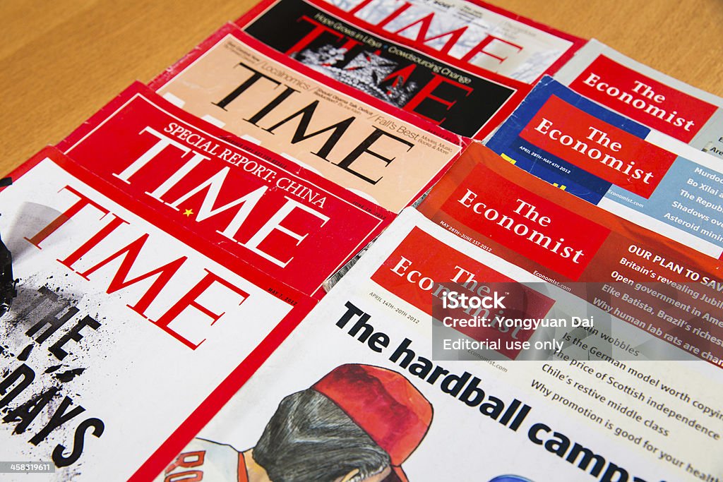Popular Magazines Shanghai, China - Oct 2, 2013: Popular Magazines in English language displayed, including Time and The Economist. Magazines are a great way to learn news, culture and short stories. They generate the majority of their income through advertising. Book Cover Stock Photo