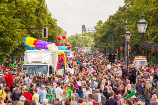 Berlin, Germany - June 25, 2011: Large crowds of people participate in the annual St Christopher Street day parade in central Berlin and make their way through the Tiergarten towards Brandenburg Gate.
