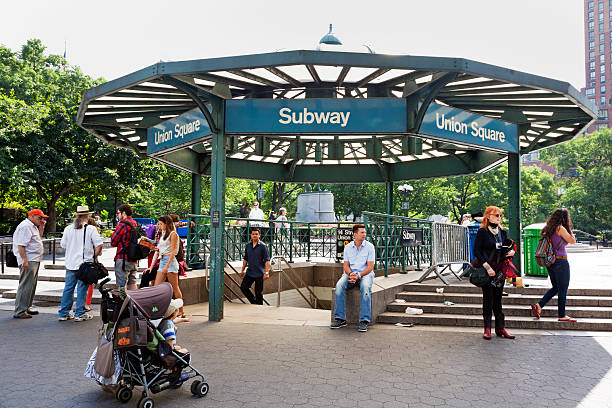 Union Square New York City New York City, USA - June 22, 2013: Subway entrance in Union Square Park in New York City. A typical cross section of New Yorkers and tourists can be seen in this shot. union square new york city stock pictures, royalty-free photos & images