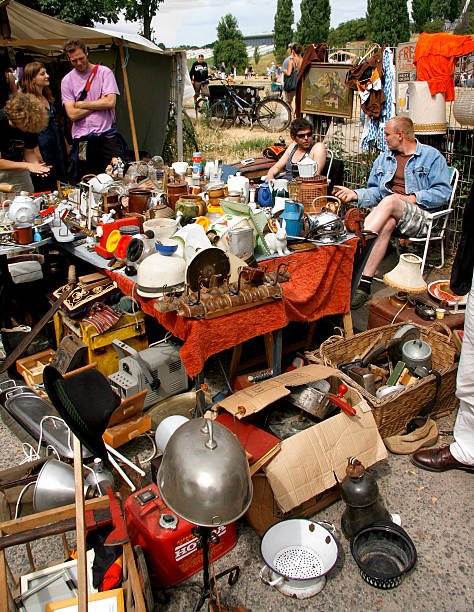 Berlin, Germany - July 18, 2010: Locals selling various merchandise at the famous sunday flea market: \