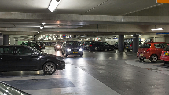 Enschede, the Netherlands - December 6, 2012 : People driving in the underground \