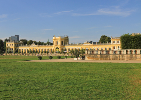 Kassel, Germany - August 16, 2012: The front of the baroque style orangerie, a castle in the central park in Kassel.